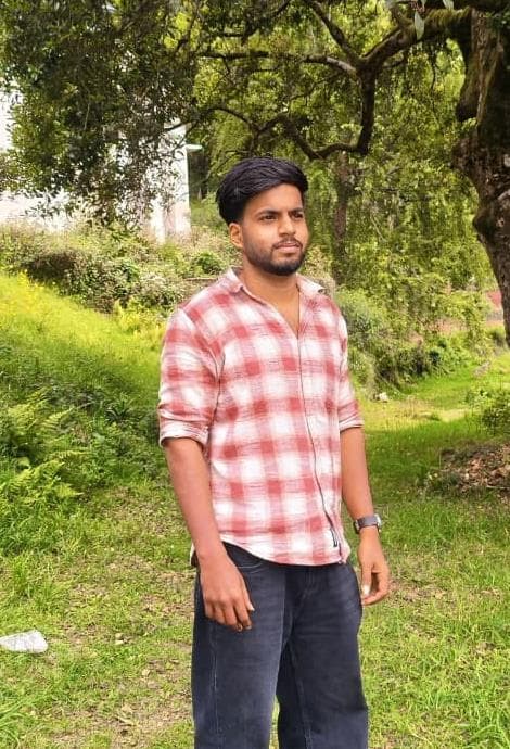 Kuberan standing outdoors
